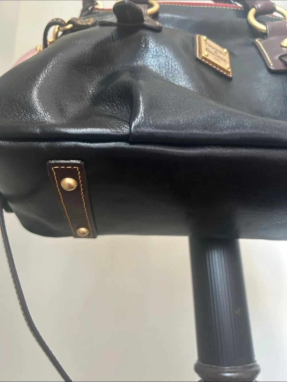 Dooney & Bourke Black Leather Satchel with Brown Trim and Gold Hardware